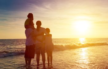 Family Standing on the Beach at Sunset Atlanta GA