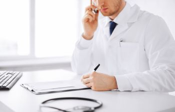 Doctor Studying Patient Chart Atlanta GA