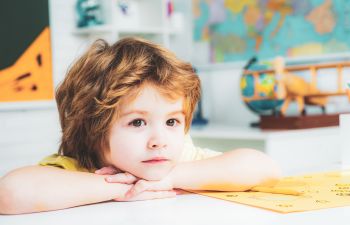 Little boy during a lesson at school.