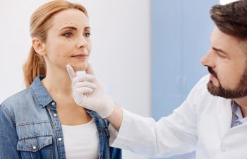 Woman Being Seen By A Dermatologist for Medical Conditions Atlanta GA