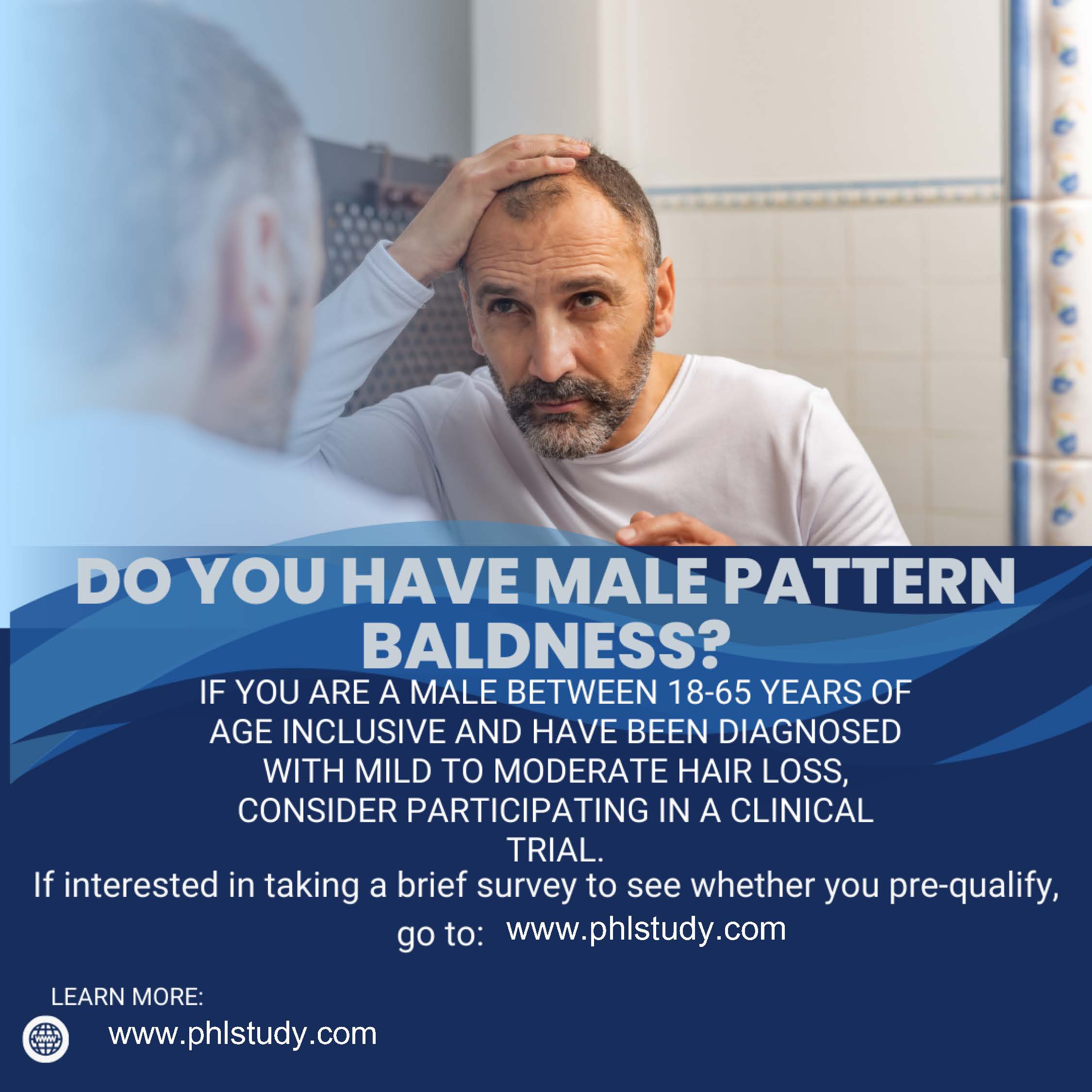A man looking at his hair in the mirror.
